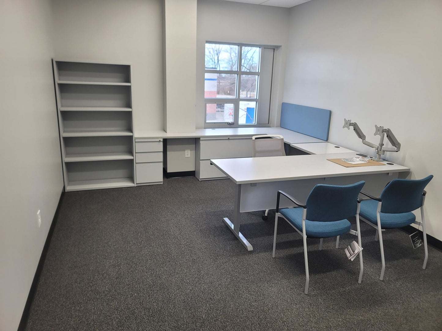Custom gen2 office desk with overhead hutch and dark charcoal finish