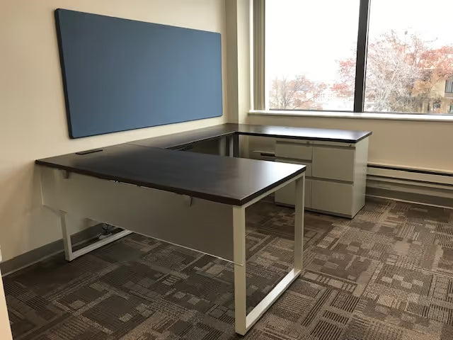 gen2 custom desk with white frame and light wood worksurface in modern workspace