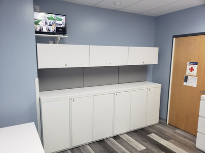 Custom overhead office storage cabinets above workstation by gen2