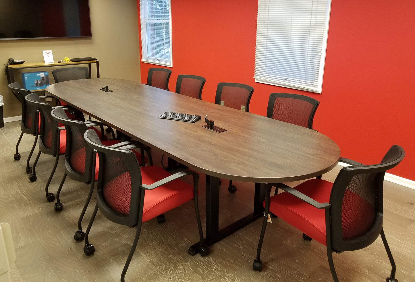 Custom racetrack conference table with gen2 Vion seating in corporate boardroom