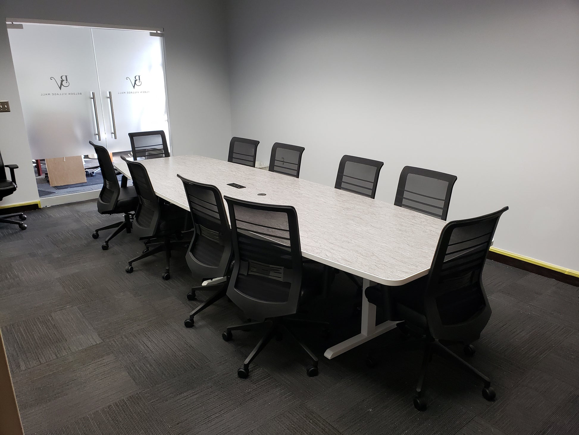 gen2 custom conference table with light laminate surface in small meeting room