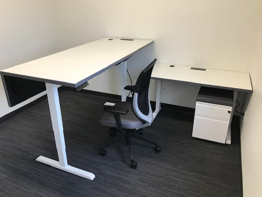 gen2 custom height adjustable office table with steel base in collaborative workspace